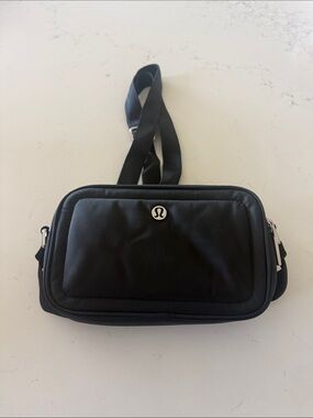 lululemon athletica Black Nylon Sling Bag with Silver Logo